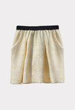 Falda corta brillante beige